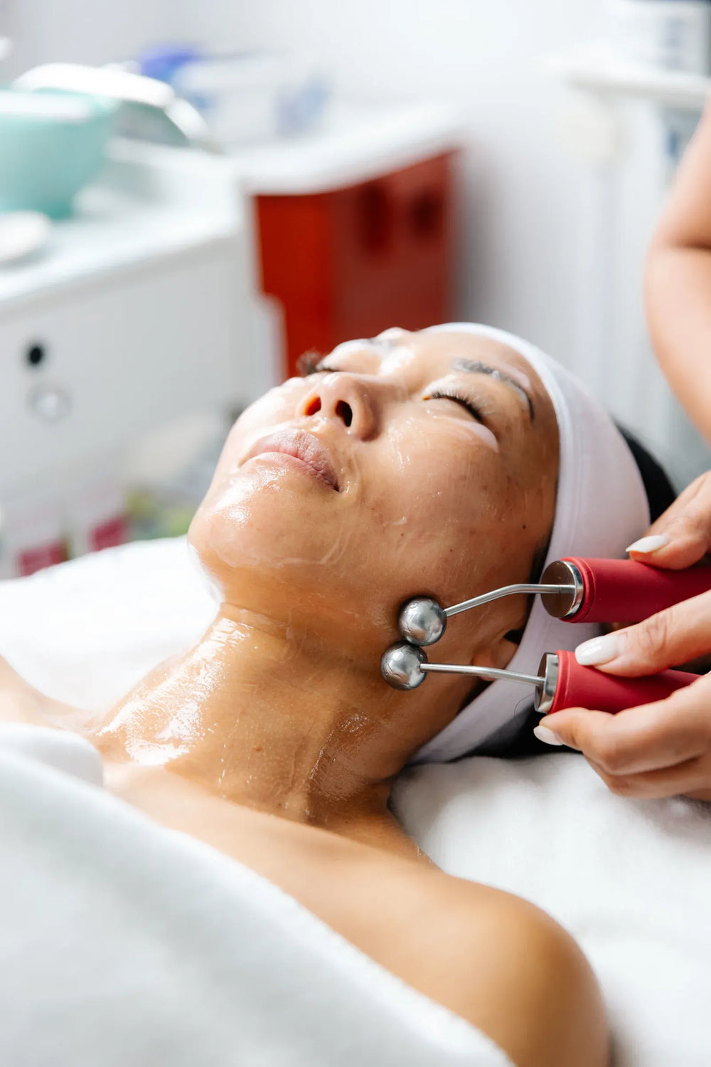 Woman at a skin clinic discussing a personalized anti-ageing treatment plan.