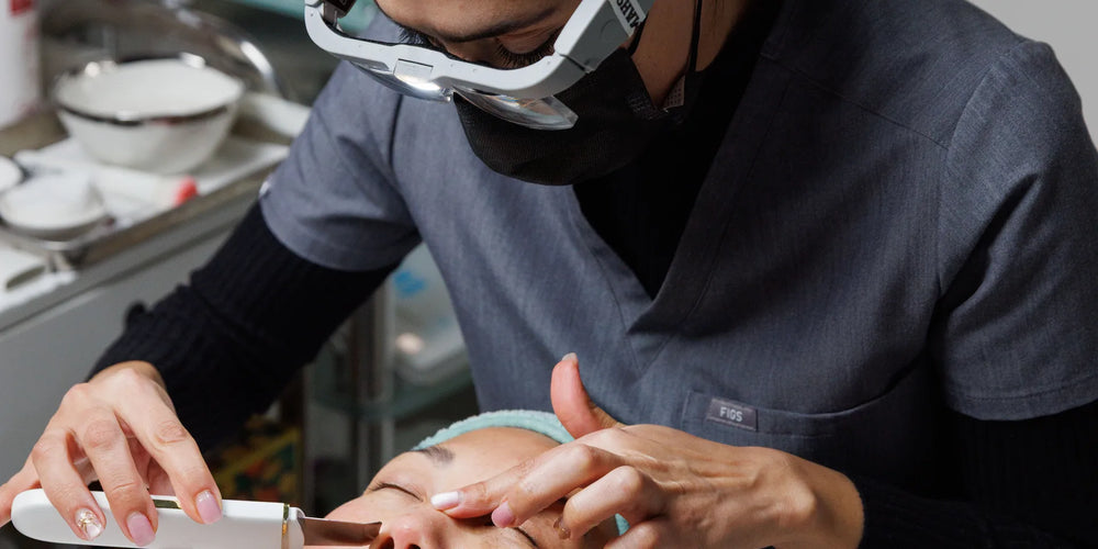 OC Skin Care Center provider performing a facial treatment on a client